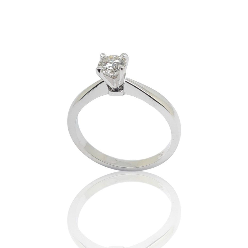 White gold single stone ring k18 with flat module and diamond tied on four teeth (code T2011)