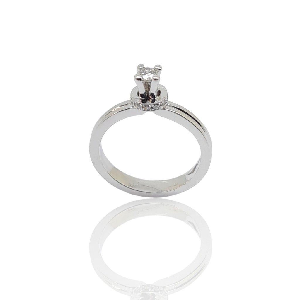 White gold single stone ring k18 with diamond on four teeth bezel and little diamonds on module (code P2001)