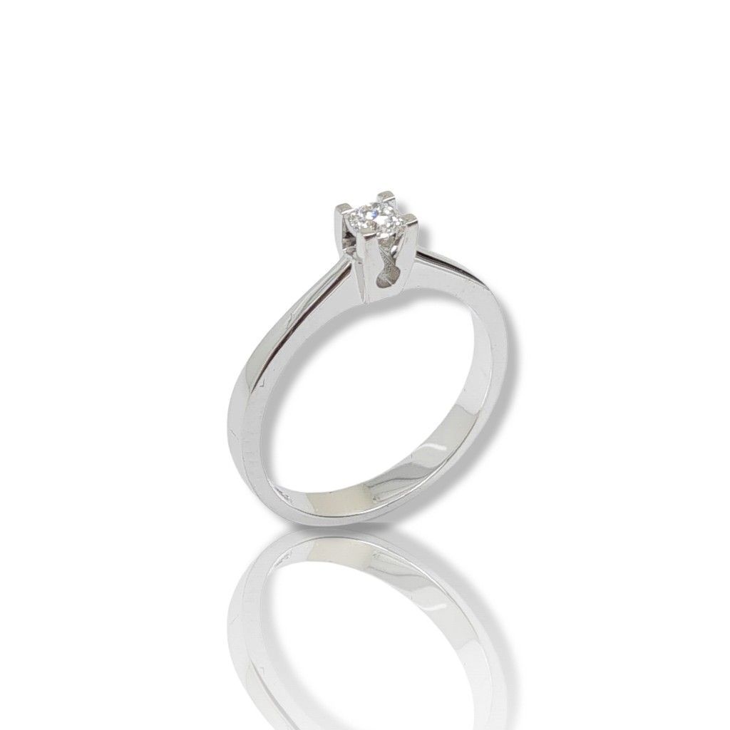 Μονόπετρο δαχτυλίδι απο λευκόχρυσο κ18 με διαμάντι δεμένο σε κομψό καστόνι με τέσσερα δόντια (code T2012)