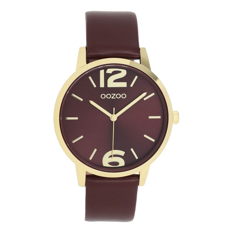 Φωτογραφία από Gold coloured OOZOO with bordeaux leather strap